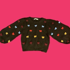 Black and multicoloured knitted jumper with bows
